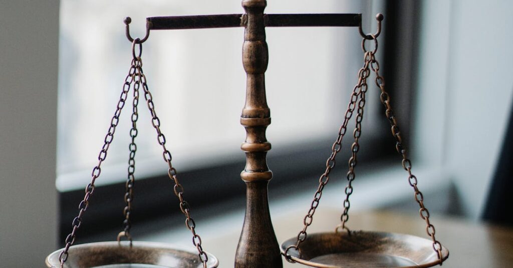 pexels-photo-5669602-5669602 Decorative judgement scale and gavel placed on desk in light lawyer office against window